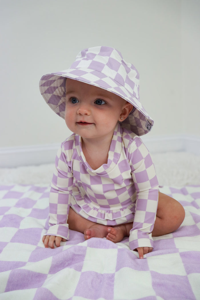 PERIWINKLE CHECKERS DREAM RASH GUARD RUFFLE TWO-PIECE SWIM SUIT